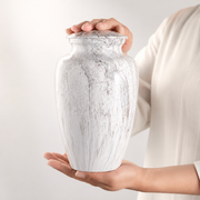 Marble-patterned finish detail on the timeless memorial urn